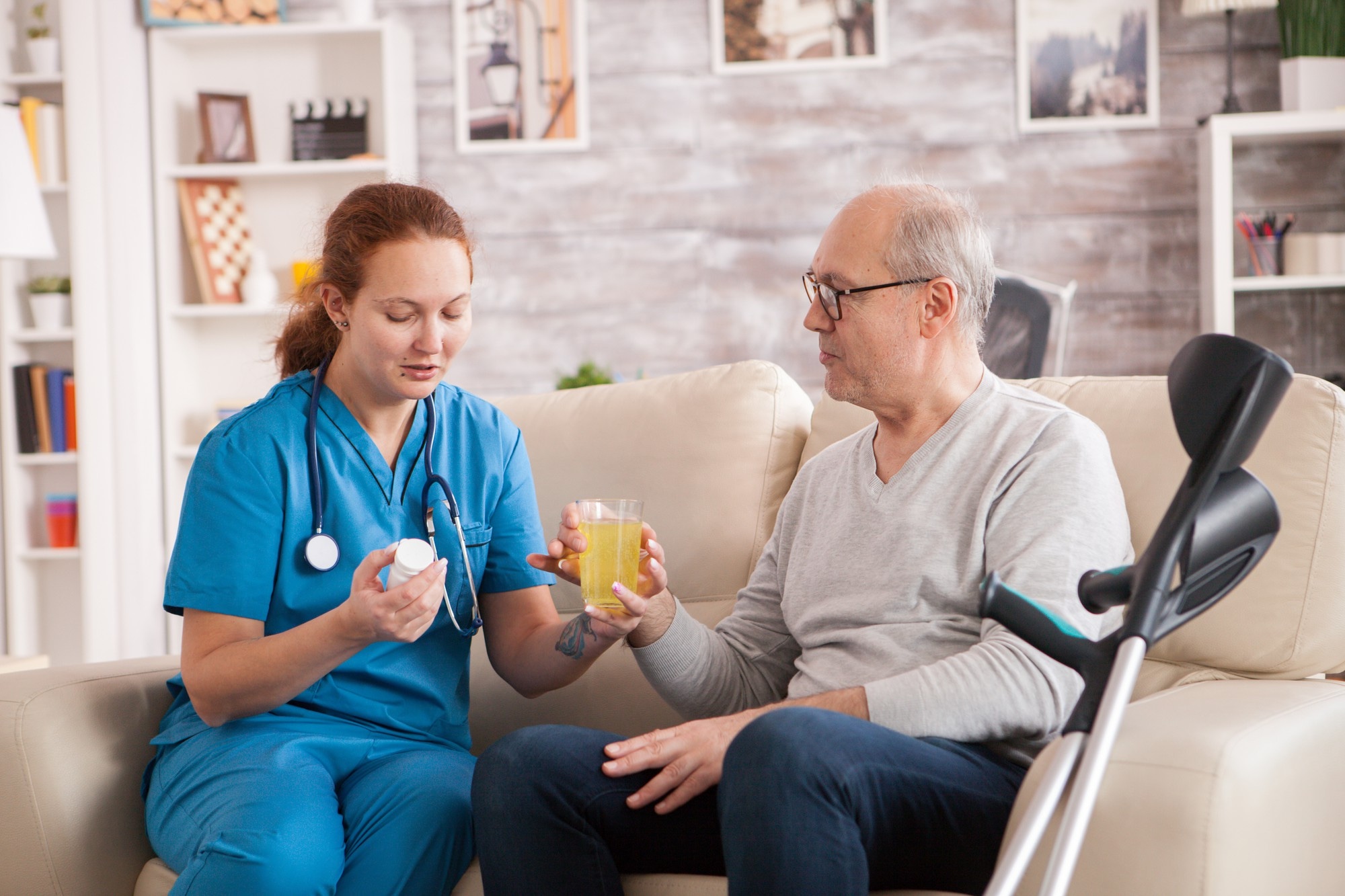 Compassionate caregiver assisting elderly person